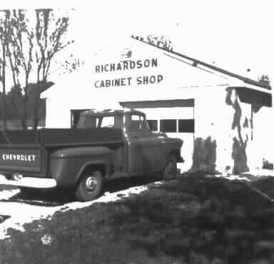 Historic black-and-white photograph of Richardson Cabinet Shop with a Chevrolet pickup truck